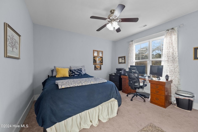 bedroom with visible vents, a ceiling fan, and carpet