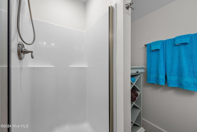 full bathroom featuring a shower stall