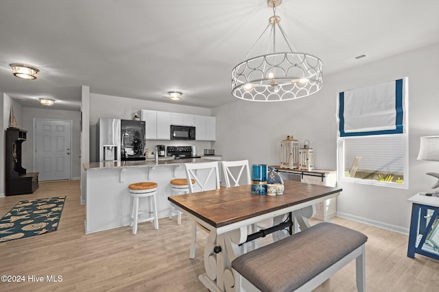 dining room featuring light hardwood / wood-style floors