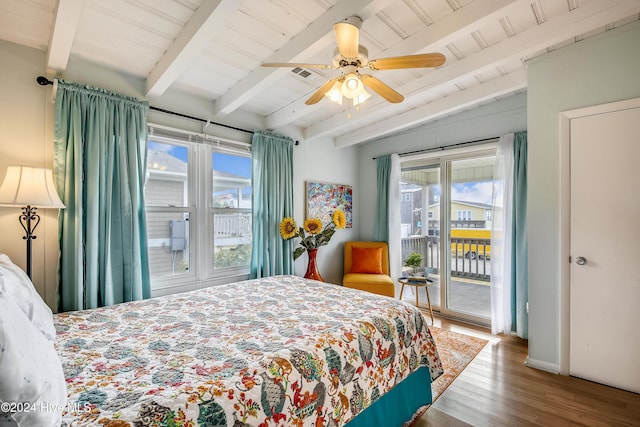 bedroom featuring hardwood / wood-style flooring, ceiling fan, access to outside, and multiple windows