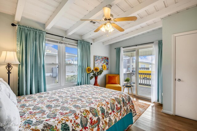 bedroom with beamed ceiling, light hardwood / wood-style flooring, ceiling fan, and wood ceiling