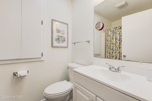 kitchen with ceiling fan, sink, white cabinets, and white appliances