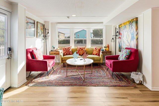 living area with hardwood / wood-style flooring