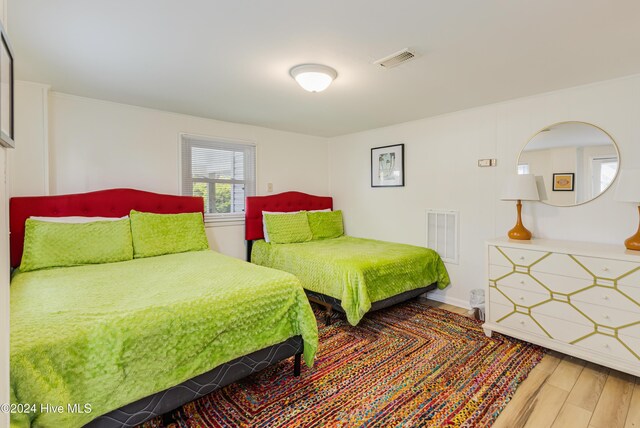 bedroom with light hardwood / wood-style floors