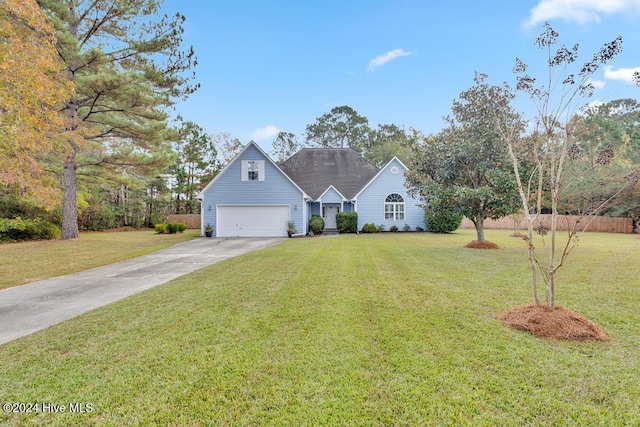 view of front of house featuring a garage and a front yard