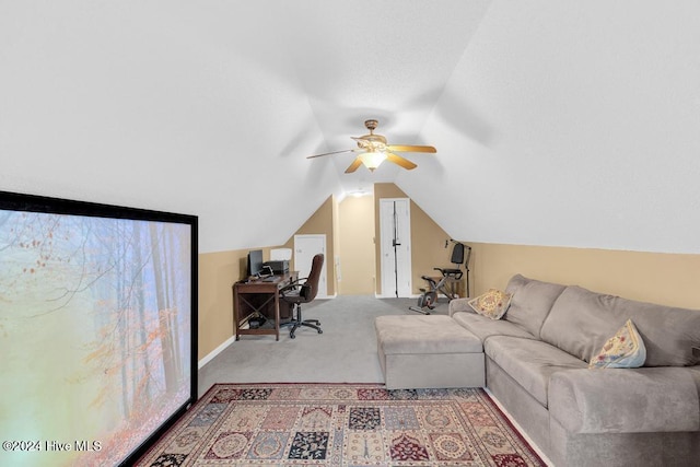 office featuring ceiling fan, carpet flooring, and vaulted ceiling