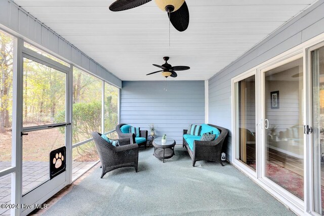 sunroom / solarium with ceiling fan