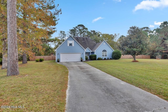 view of front of home featuring a garage and a front yard