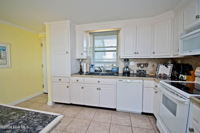 kitchen featuring tasteful backsplash, crown molding, white cabinets, and white appliances