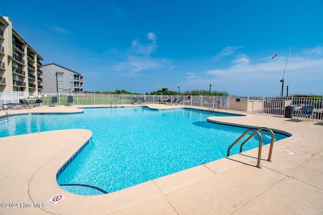 view of pool featuring a patio area