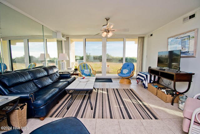 tiled living room with plenty of natural light, crown molding, and ceiling fan