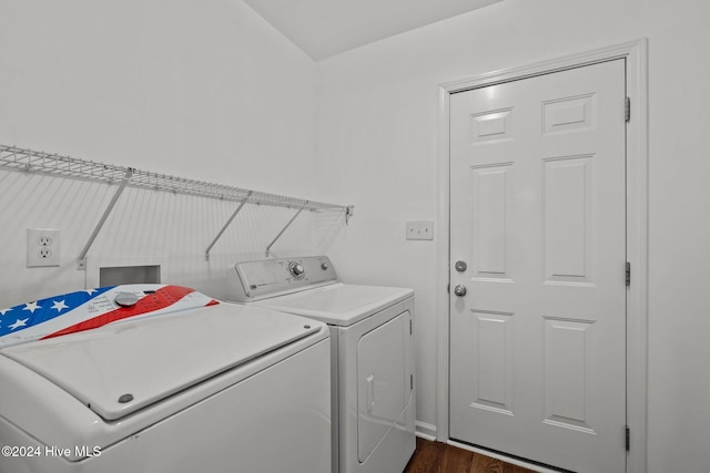 laundry room featuring washing machine and dryer and dark hardwood / wood-style floors