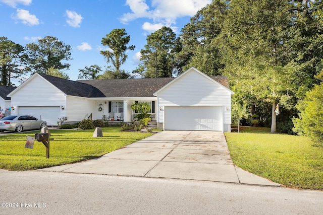 single story home featuring a garage, driveway, and a front lawn