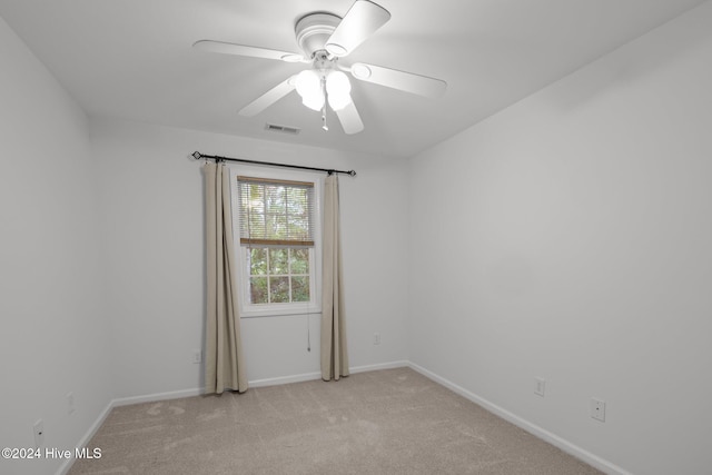 empty room with light carpet and ceiling fan