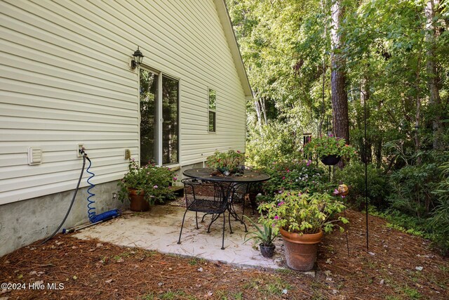 view of property exterior featuring a patio area