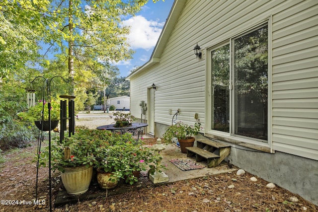 view of side of property with entry steps