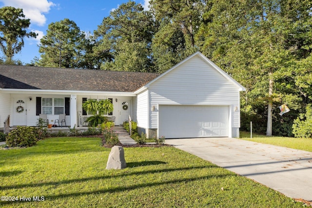 single story home featuring a front yard, a porch, and a garage