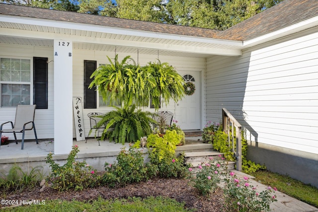 doorway to property featuring a porch