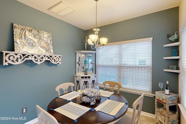 dining room featuring a chandelier