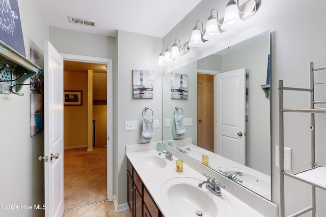 bathroom featuring tile patterned floors and vanity