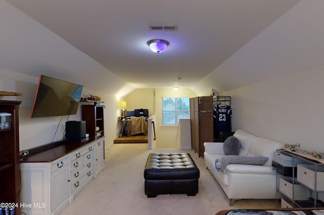 interior space featuring light carpet and vaulted ceiling