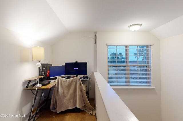 office area featuring hardwood / wood-style floors and lofted ceiling