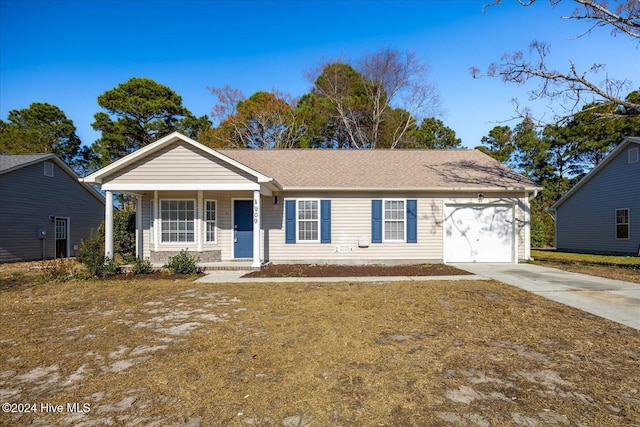 single story home with a porch and a garage