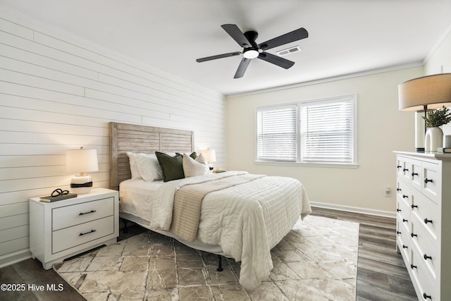 bedroom featuring wood-type flooring, ceiling fan, and crown molding