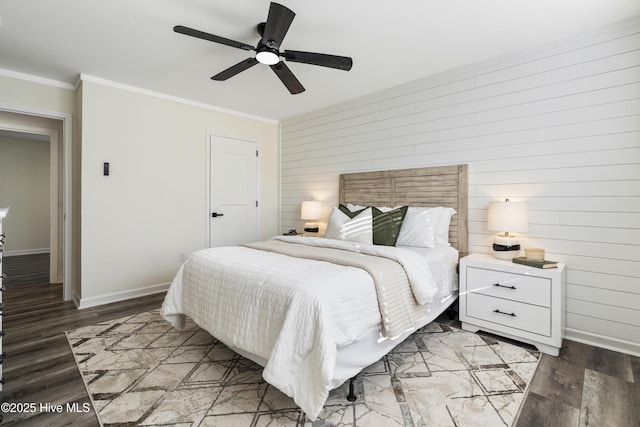 bedroom with hardwood / wood-style flooring, ceiling fan, and crown molding