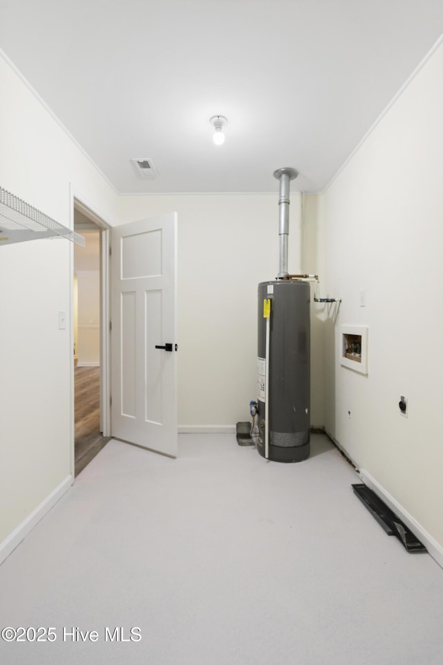 utility room featuring water heater