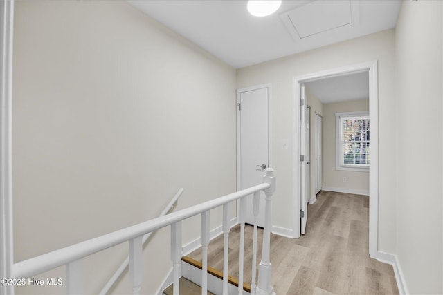 hallway with light hardwood / wood-style floors