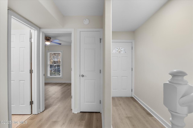 corridor featuring light hardwood / wood-style floors