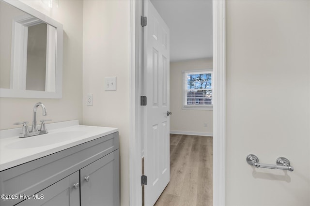 bathroom featuring vanity and hardwood / wood-style floors