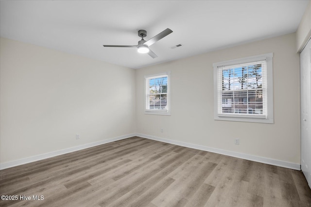 spare room with ceiling fan and light hardwood / wood-style floors