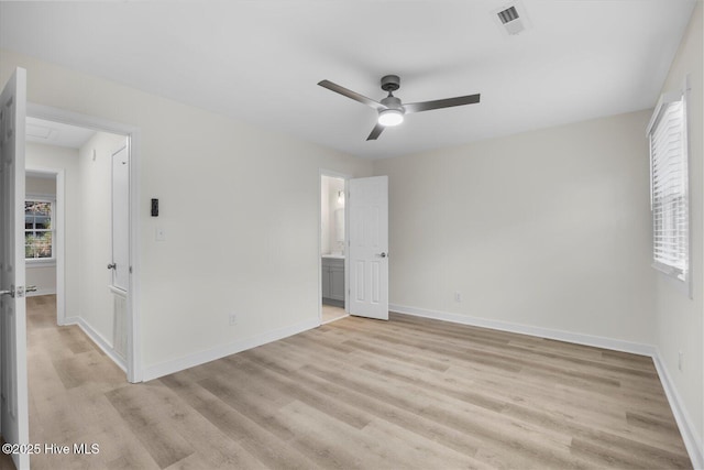 unfurnished bedroom featuring ensuite bathroom, ceiling fan, and light hardwood / wood-style flooring