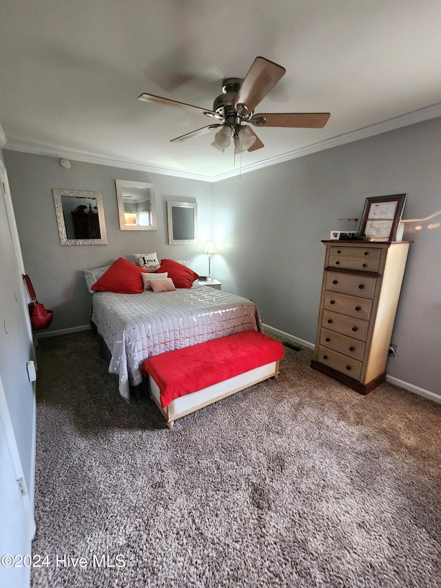 bedroom featuring ceiling fan, crown molding, and dark colored carpet