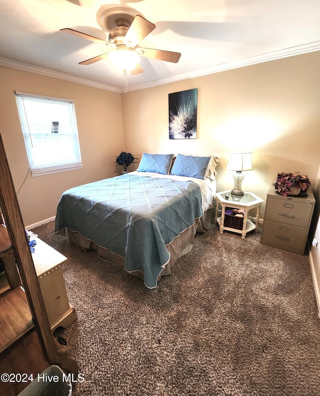 carpeted bedroom with ceiling fan and ornamental molding