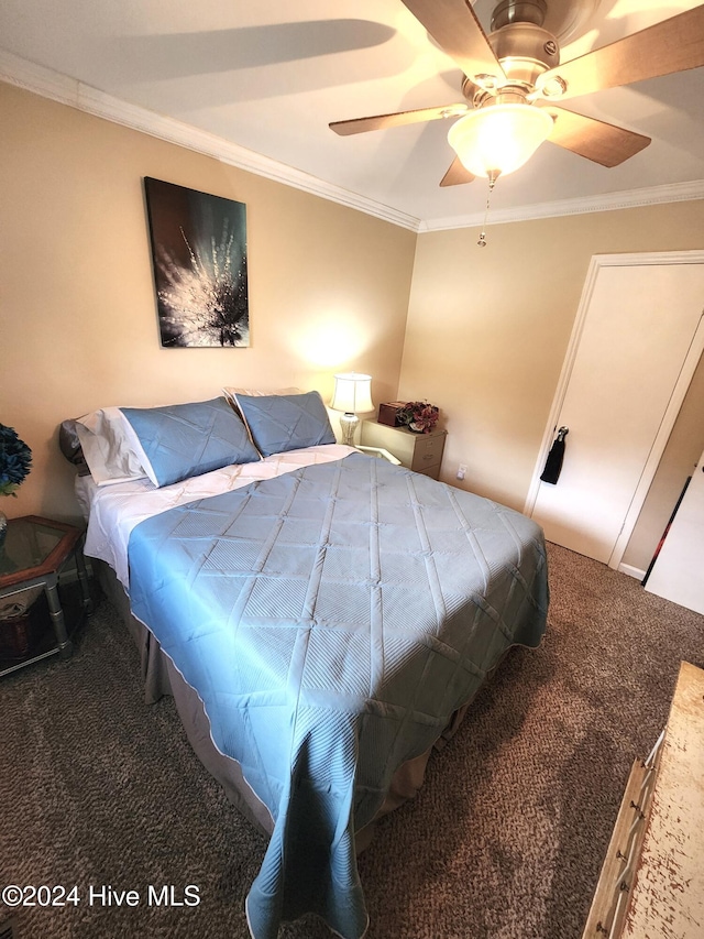 carpeted bedroom with ceiling fan and crown molding