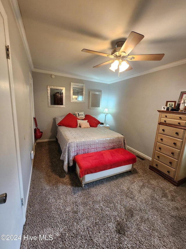 carpeted bedroom with a ceiling fan, baseboards, and ornamental molding