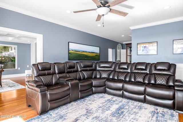 living room with wood-type flooring, ceiling fan, and ornamental molding