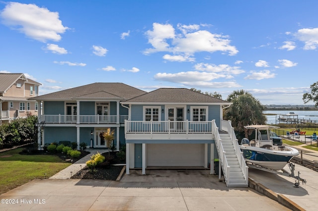 view of front of home featuring a garage and a water view