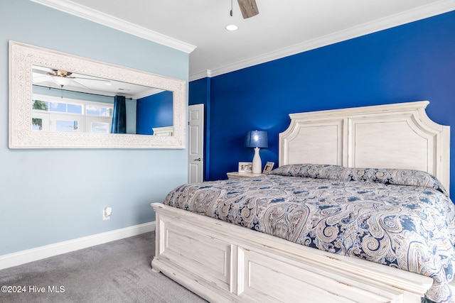 carpeted bedroom with ceiling fan and ornamental molding