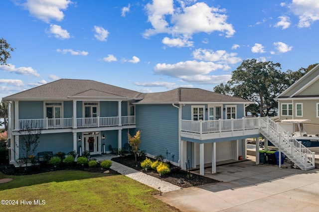 view of front of property with a front lawn and a garage