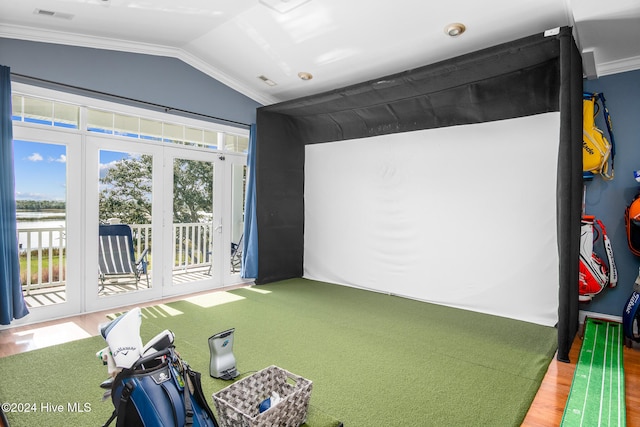 game room with hardwood / wood-style floors, crown molding, golf simulator, and lofted ceiling