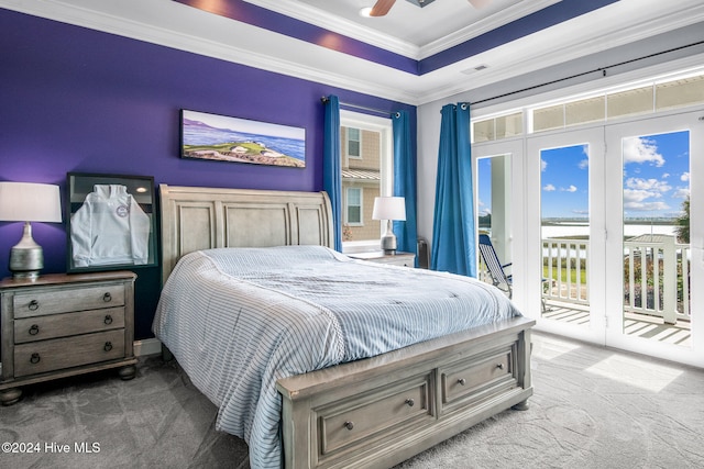 carpeted bedroom featuring access to outside, multiple windows, ceiling fan, and ornamental molding