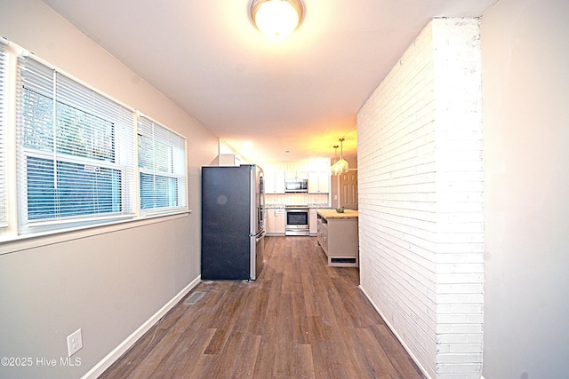 hall with dark hardwood / wood-style flooring