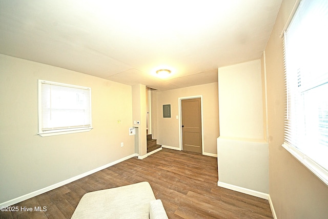 unfurnished room featuring hardwood / wood-style flooring and a healthy amount of sunlight