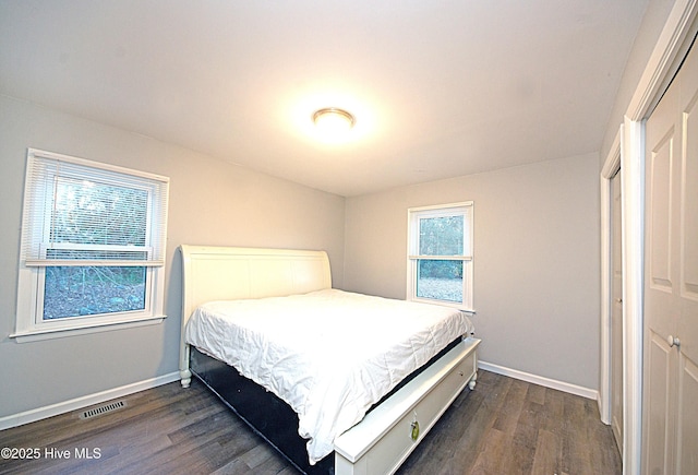 bedroom featuring dark hardwood / wood-style floors