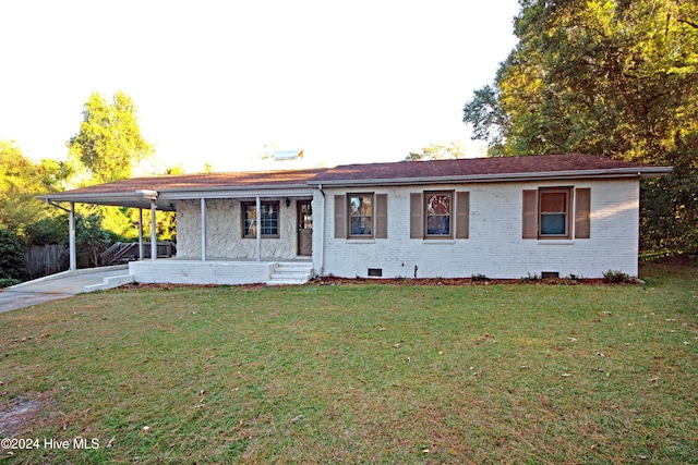 ranch-style home featuring a porch and a front yard