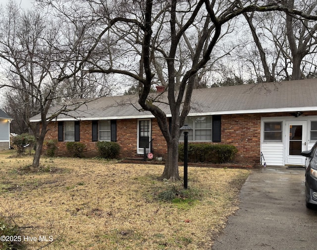 single story home with brick siding